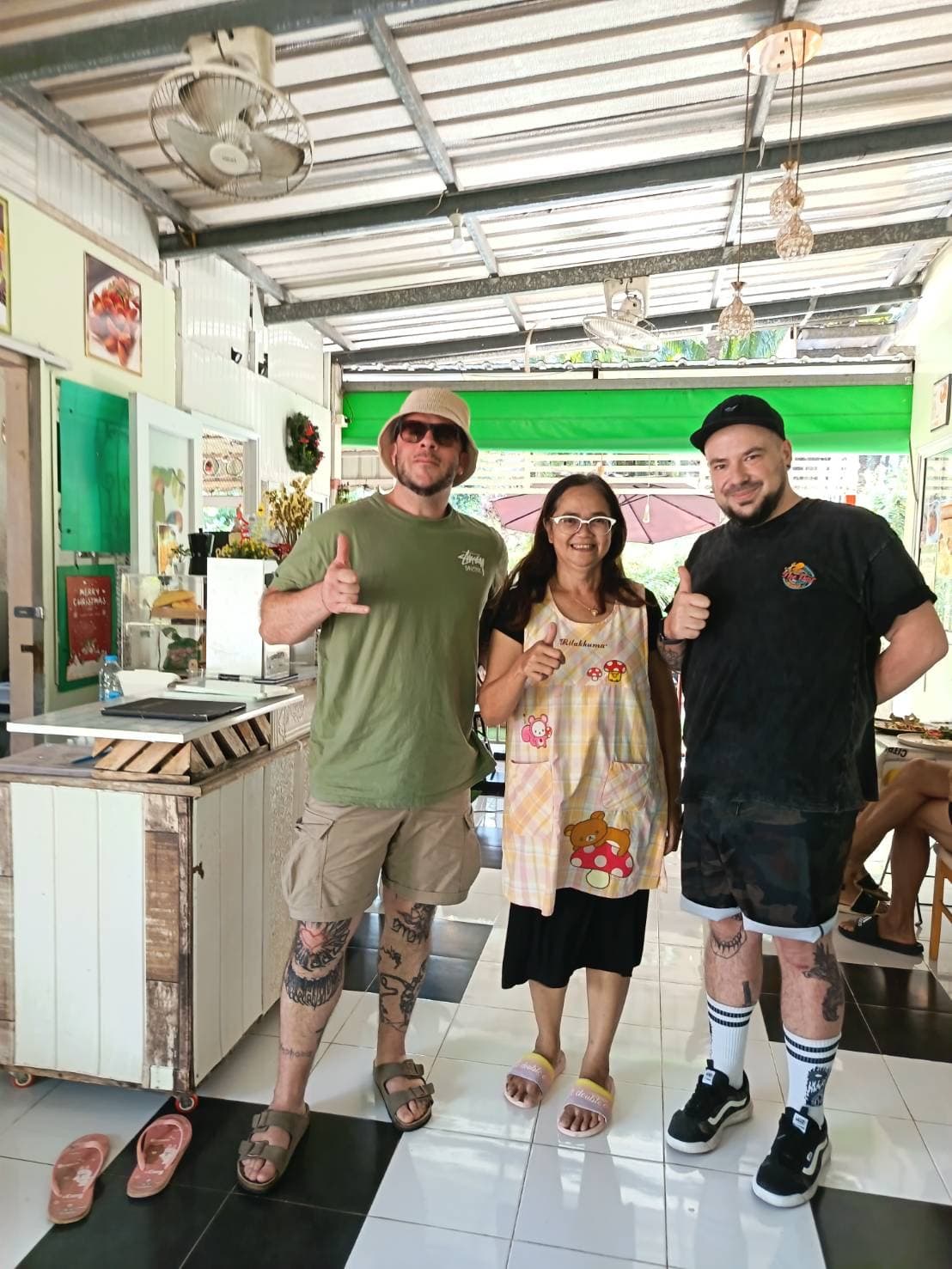 Happy guests giving thumbs up at MaeKung Cafe Krabi — highly recommended