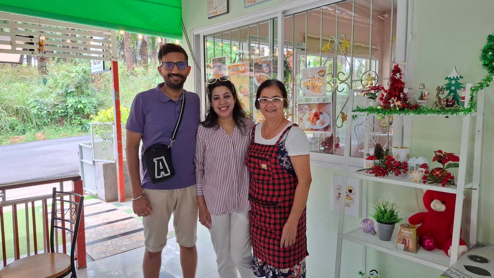 Owner warmly welcoming guests inside MaeKung Cafe Krabi