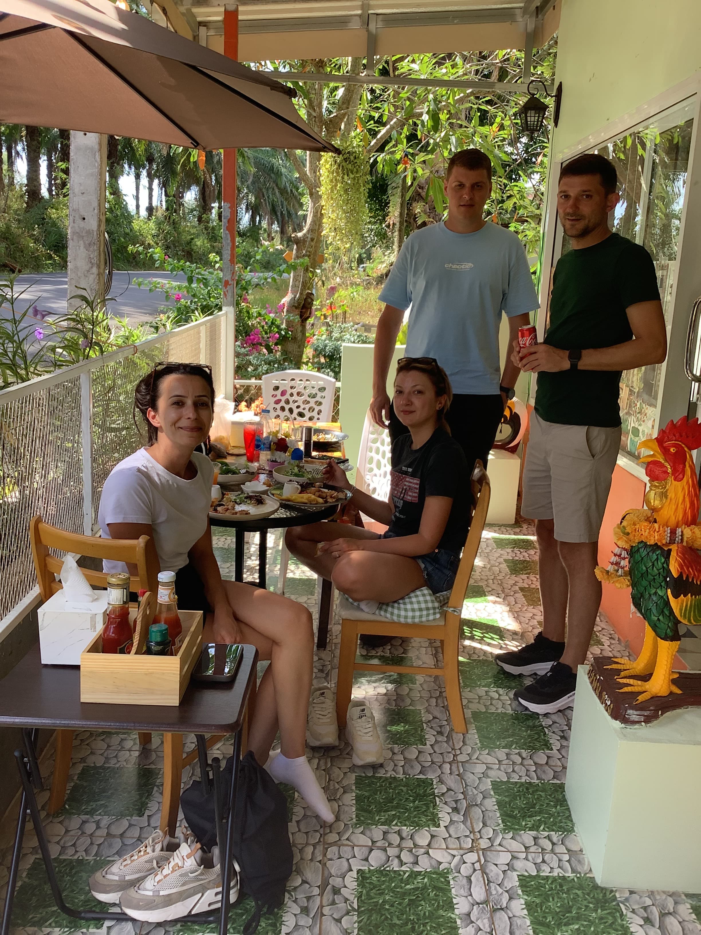 Group of guests enjoying a meal together inside MaeKung Cafe Krabi